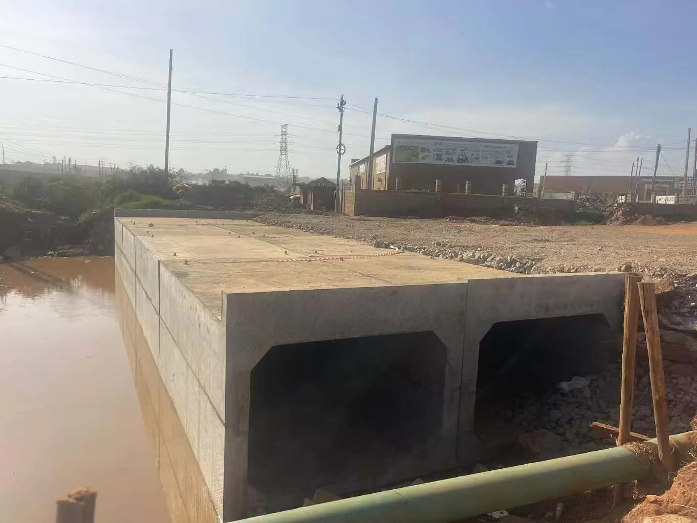Precast box culvert with two openings beside a drainage channel