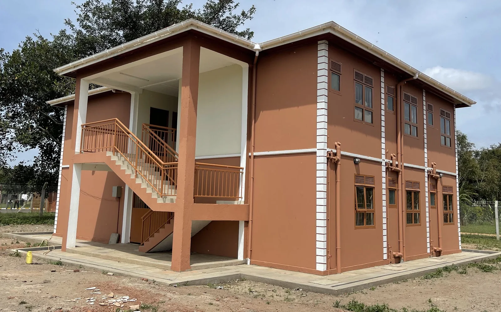 Two-storey construction with external stair access from company photographs